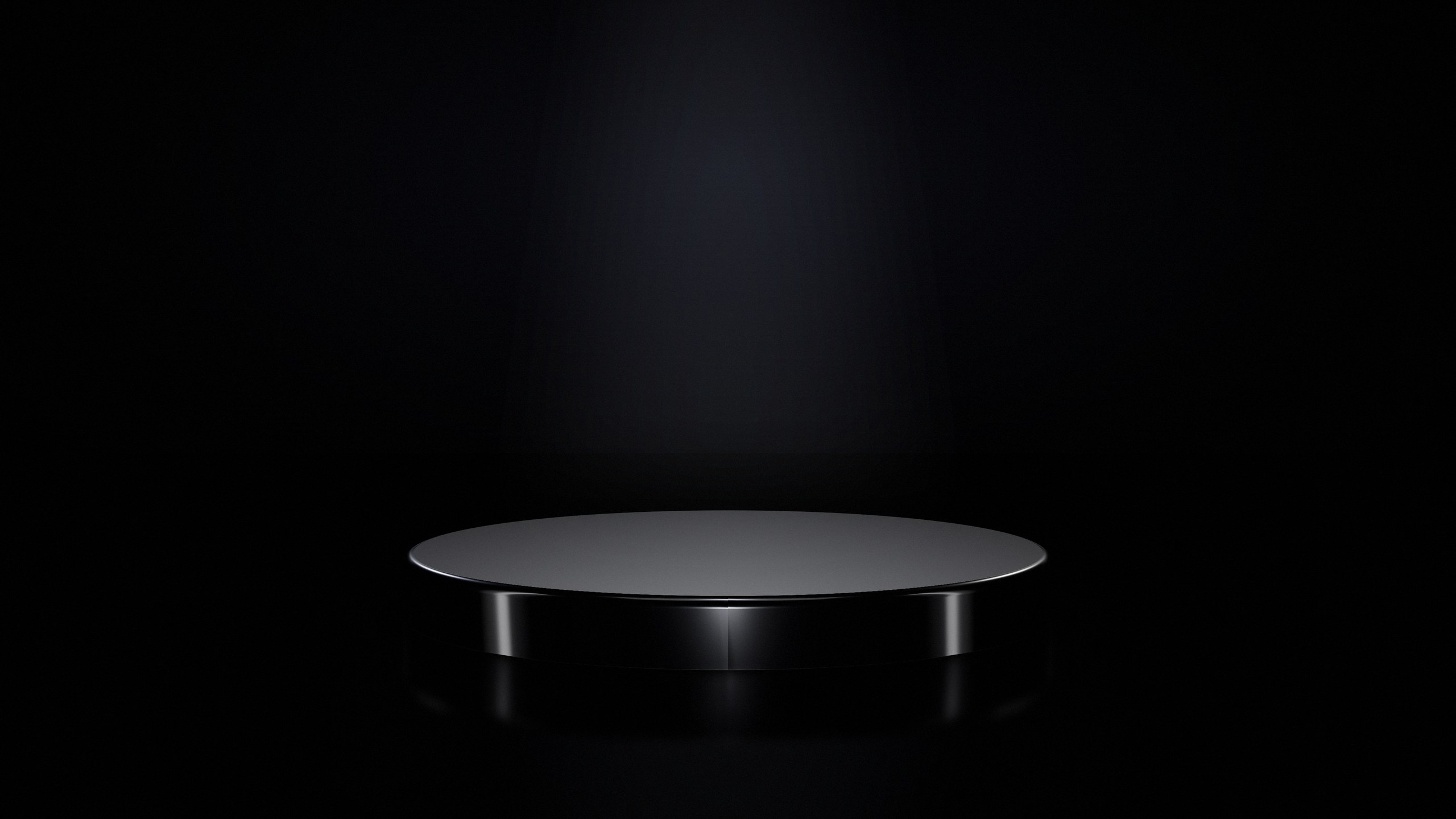 An empty podium under a single spotlight. This is Nothing.